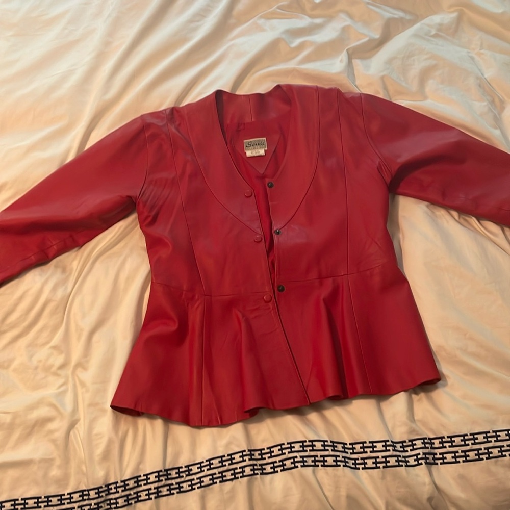 Beautiful red leather vintage jacket. Gently used. Hem needs to be resewn